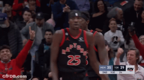 A Group Of Basketball Players Wearing Toronto Raptors Uniforms Shake Hands GIF
