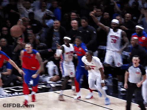A Group Of Basketball Players With One Wearing A Number 23 Jersey GIF