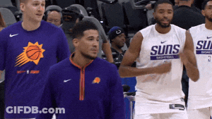 A Group Of Basketball Players With One Wearing A Shirt That Says Suns GIF