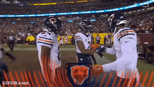 A Group Of Bears Players Are Standing On A Field GIF