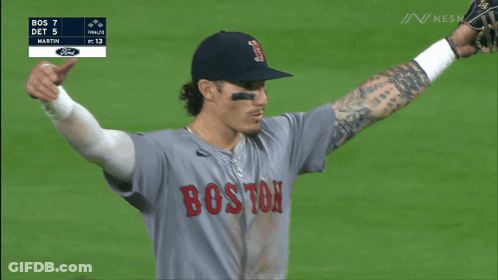 A Group Of Boston Baseball Players Are Hugging Each Other GIF