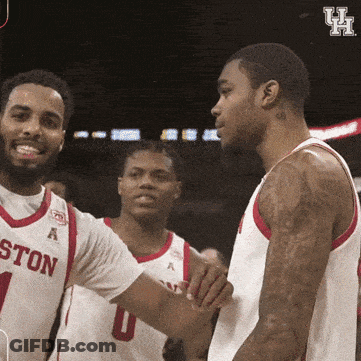 A Group Of Boston Basketball Players Shake Hands With Each Other GIF
