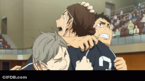 A Group Of Boys Are Hugging Each Other And One Of Them Has The Number 7 On His Shirt GIF