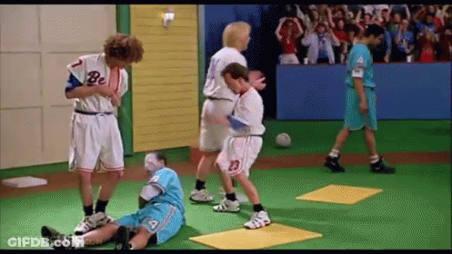A Group Of Boys Are Playing A Game Of Soccer On A Green Field . GIF