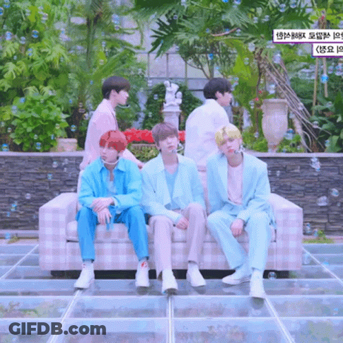 A Group Of Boys Are Sitting On A Couch With Bubbles Surrounding Them GIF