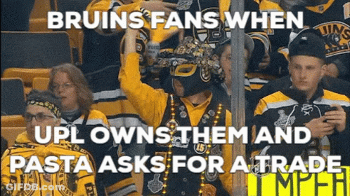 A Group Of Bruins Fans Are Sitting In A Stadium Watching A Hockey Game GIF