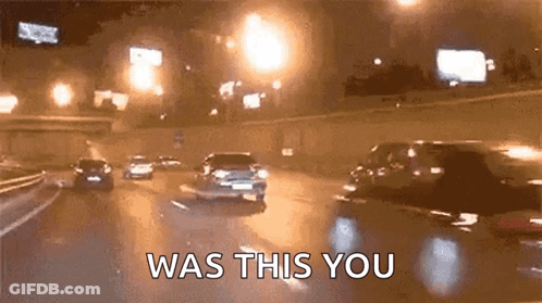 A Group Of Cars Are Driving Down A Highway At Night And The Words `` Was This You '' Are Visible . GIF