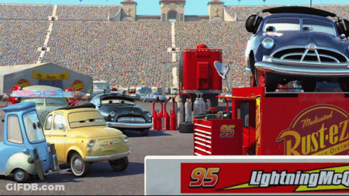 A Group Of Cars Are Parked In Front Of A Sign That Says Lightning Mcqueen GIF