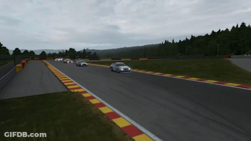 A Group Of Cars Are Racing Down A Track GIF