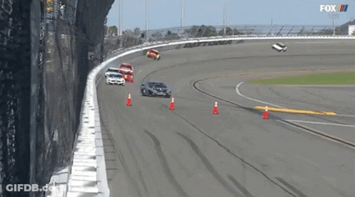 A Group Of Cars Are Racing On A Race Track With A Fox Logo In The Background GIF