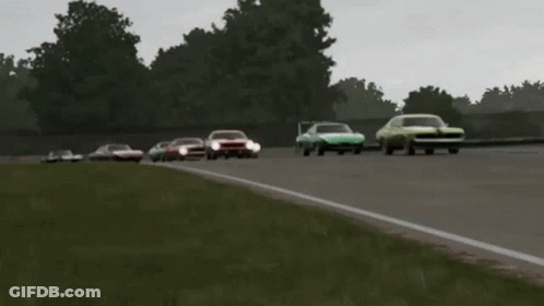 A Group Of Cars Are Racing On A Track And One Of Them Has The Word Ford On It GIF