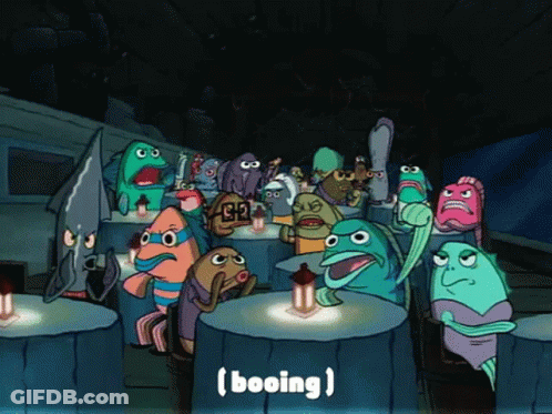 A Group Of Cartoon Characters Are Gathered Around A Table With The Word Booing Written On The Bottom GIF