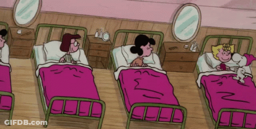 A Group Of Cartoon Characters Are Laying In Beds With Pink Blankets GIF