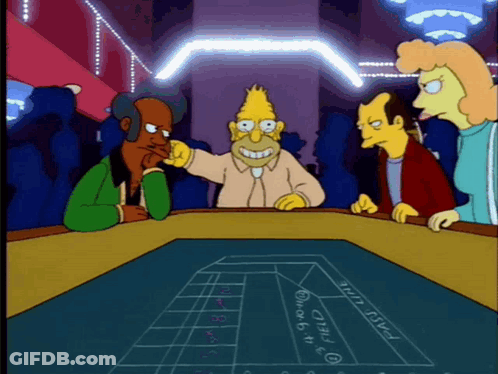 A Group Of Cartoon Characters Are Playing A Game Of Roulette And One Of Them Has A Drawing Of A Roulette Table On The Ta GIF