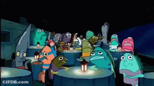 A Group Of Cartoon Characters Are Sitting Around A Table With Lanterns . GIF