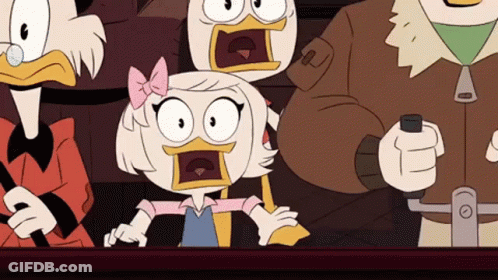 A Group Of Cartoon Characters Are Sitting Around A Table With Their Mouths Open And Their Faces Surprised . GIF