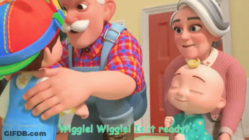 A Group Of Cartoon Characters Are Standing Around A Table And One Of Them Is Holding A Baby . GIF