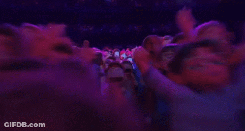 A Group Of Cartoon Characters Are Standing In A Room With Purple Lights . GIF