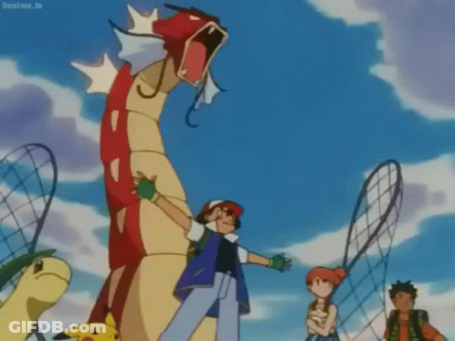 A Group Of Cartoon Characters Are Standing In Front Of A Large Red And Yellow Dragon . GIF