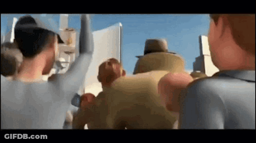 A Group Of Cartoon Characters Are Standing Next To Each Other In A Crowd Of People . GIF