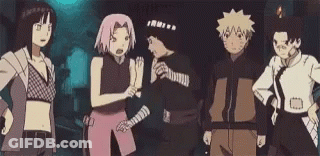 A Group Of Cartoon Characters Are Standing Next To Each Other In A Dark Room . GIF