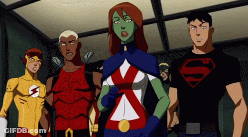 A Group Of Cartoon Characters Are Standing Next To Each Other With One Wearing A Superman Shirt GIF