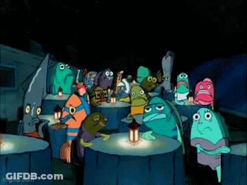 A Group Of Cartoon Characters Sitting Around A Table With A Lantern In The Dark . GIF