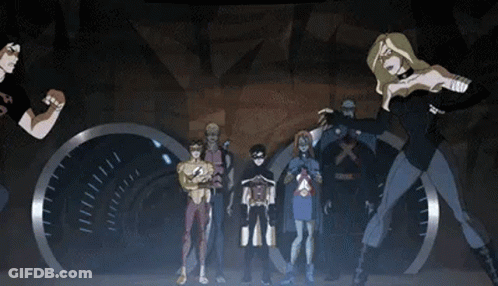 A Group Of Cartoon Characters Standing Next To Each Other In A Dark Room . GIF