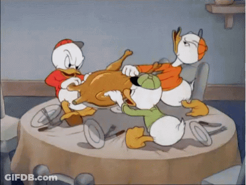 A Group Of Cartoon Ducks Are Eating A Turkey GIF