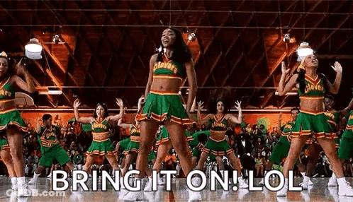A Group Of Cheerleaders Are Dancing On A Basketball Court In Front Of A Crowd Of People . GIF
