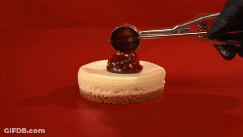 A Group Of Cheesecakes With Whipped Cream And Jelly On Top GIF