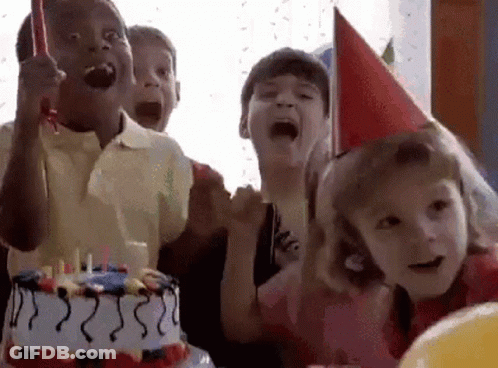 A Group Of Children Are Celebrating A Birthday With A Birthday Cake . GIF