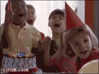 A Group Of Children Are Celebrating A Birthday With A Birthday Cake . GIF