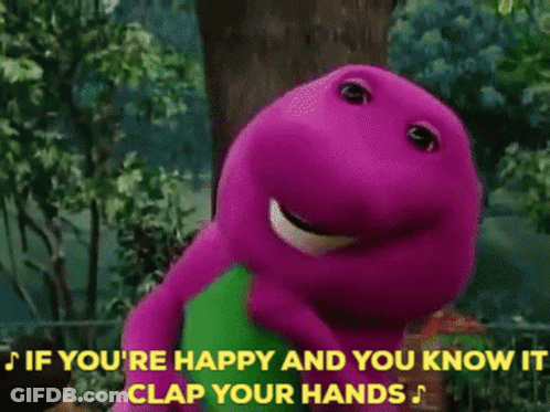 A Group Of Children Are Clapping Their Hands In Front Of A Purple And Green Dinosaur GIF