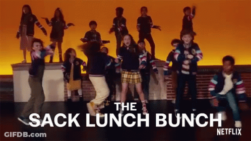 A Group Of Children Are Dancing On A Stage With The Words " The Sack Lunch Bunch " Written Above Them GIF