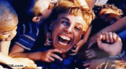 A Group Of Children Are Playing With A Man 'S Face While He Laughs . GIF