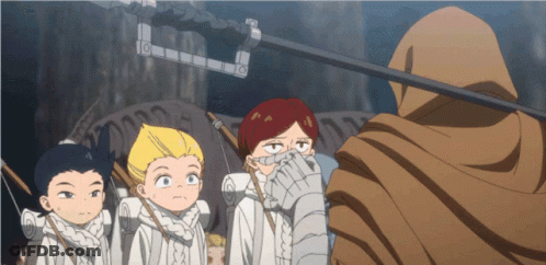 A Group Of Children Are Standing In Front Of A Man With A Hood GIF