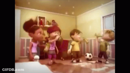 A Group Of Children Playing With A Soccer Ball In A Room GIF