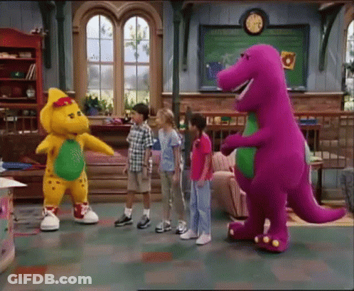 A Group Of Children Standing Around A Purple And Yellow Dinosaur GIF