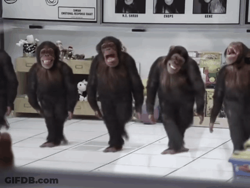 A Group Of Chimpanzees Are Dancing In Front Of A Sign That Says ' Slimmer Emotional Response Chart ' GIF