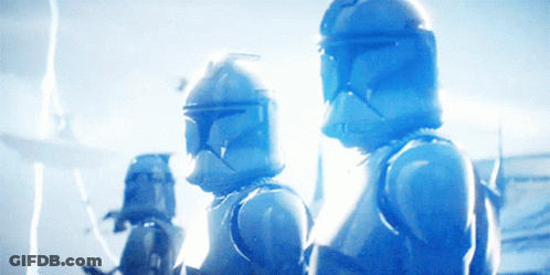 A Group Of Clone Troopers Are Standing Next To Each Other In A Blue Light GIF