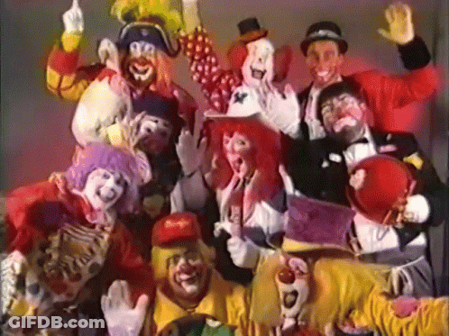 A Group Of Clowns Are Posing For A Photo And One Has A Mcdonald 'S Hat On GIF