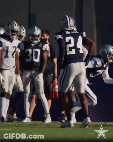 A Group Of Cowboys Football Players Including Number 24 GIF