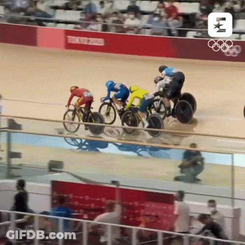 A Group Of Cyclists Are Racing On A Track With Tokyo 2020 Written On The Wall Behind Them GIF
