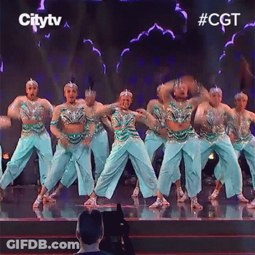 A Group Of Dancers Are Performing On A Stage With The Words Citytv Behind Them GIF