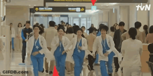 A Group Of Doctors Are Running Through A Hospital Hallway With Tvn Written On The Bottom GIF