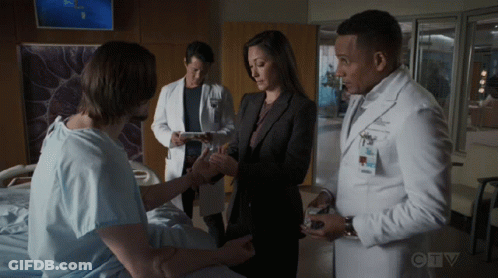 A Group Of Doctors Are Talking To A Patient In A Hospital Room With Ctv Written On The Bottom Of The Screen GIF