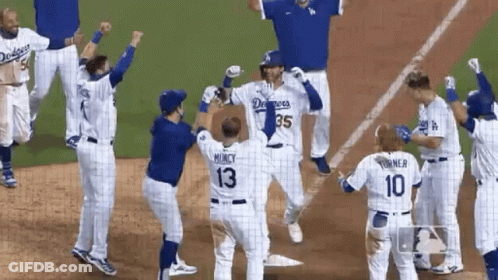 A Group Of Dodgers Baseball Players Are Celebrating GIF