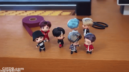 A Group Of Dolls Are Standing On A Wooden Table With The Hashtag Bogoshipdarmin GIF