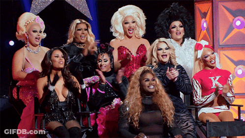Drag Queens Posing With Pink K Sweater GIF